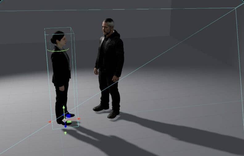 The 3D cast on the grey-box set, one selected with move handles, the camera frustum framing them